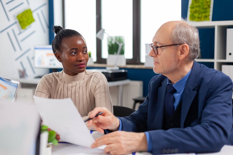 african-employee-discussing-with-senior-executive-2023-11-27-05-18-36-utc